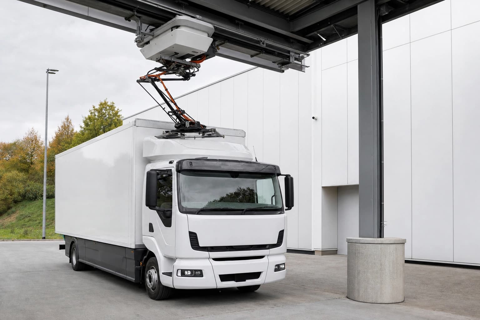 Overhead charging system on a truck at a fleet site
